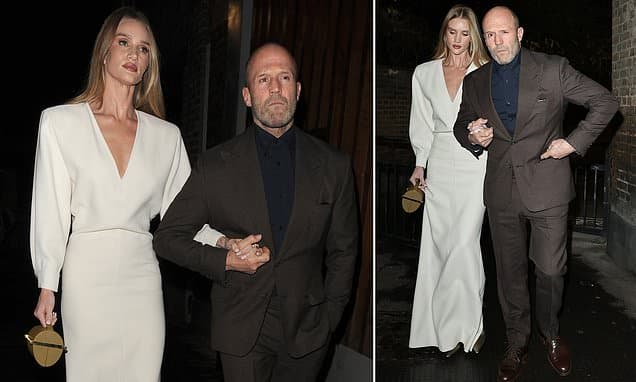 Rosie Huntington-Whiteley Dazzles in White Gown with Jason Statham at Art Launch